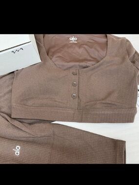 ALO Yoga Ribbed Henley Crop Top in Taupe Brown with matching ribbed leggings